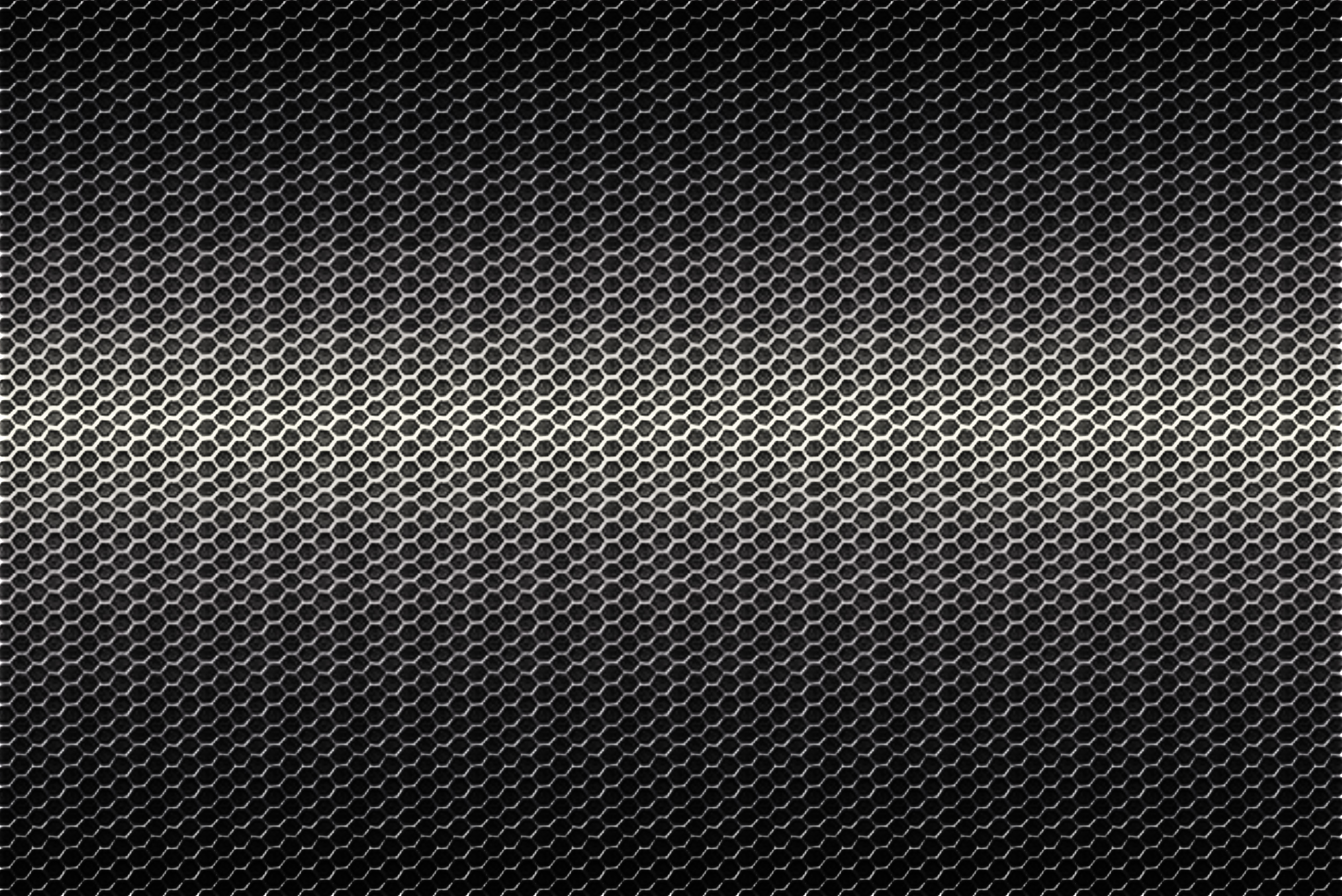Текстура металлической сетки черного цвета с градиентом.