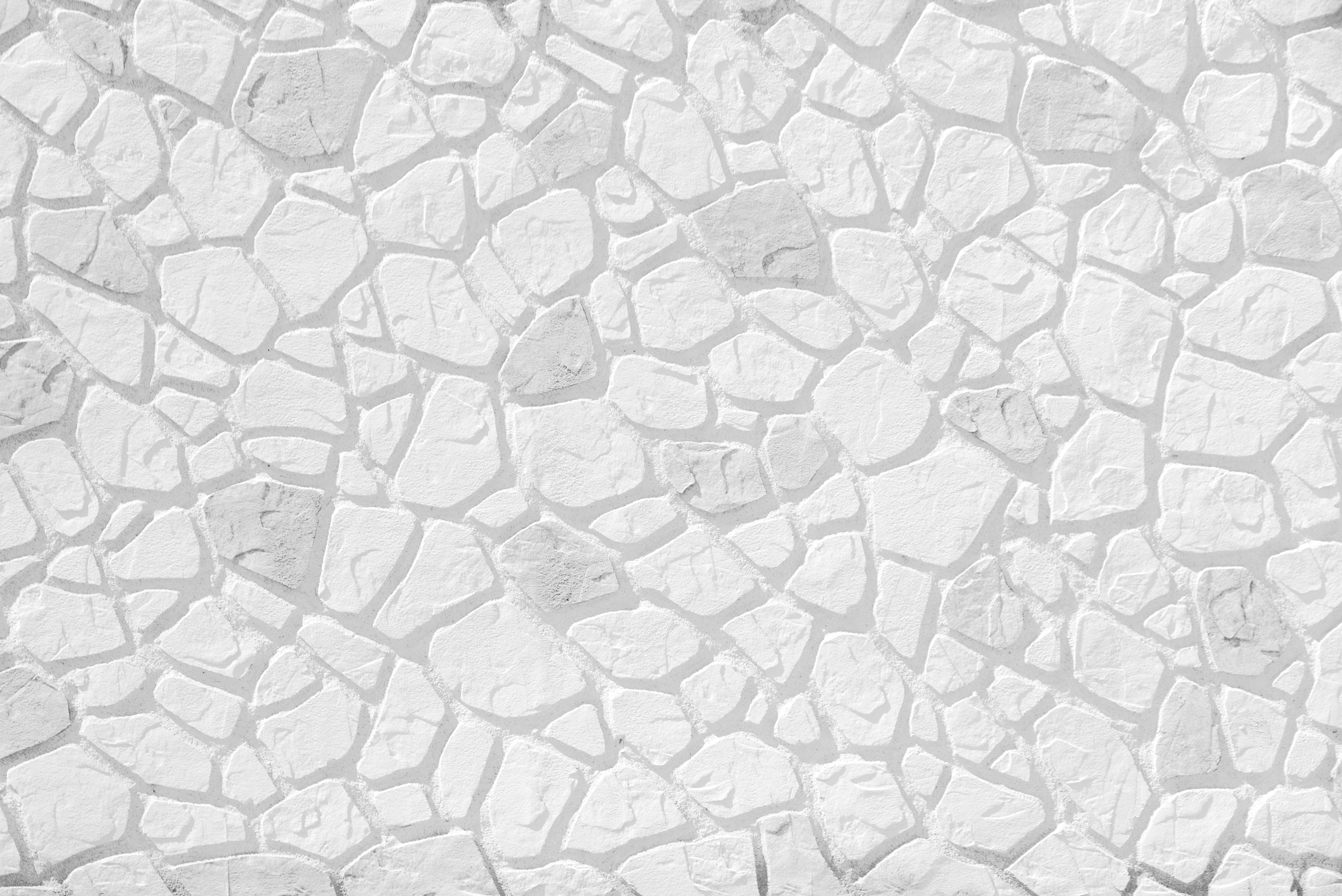 Текстура поверхность стены из белого облицовочного камня.
