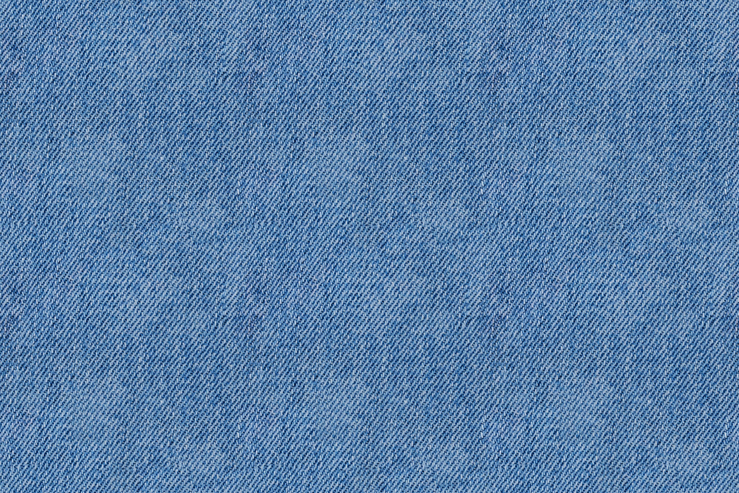 Текстура джинсы из голубой ткани деним.