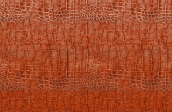 Текстура оранжевой лаковой кожи крокодила.