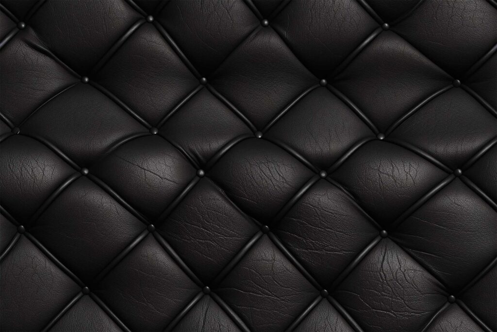Бесшовная текстура черной кожи на обивке дивана.